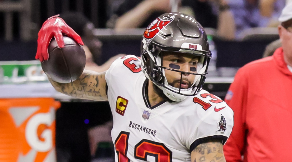 Tampa Bay Buccaneers wide receiver Evans (13) is shoved out of bounds vs. the Saints on Sept. 18, 2022.